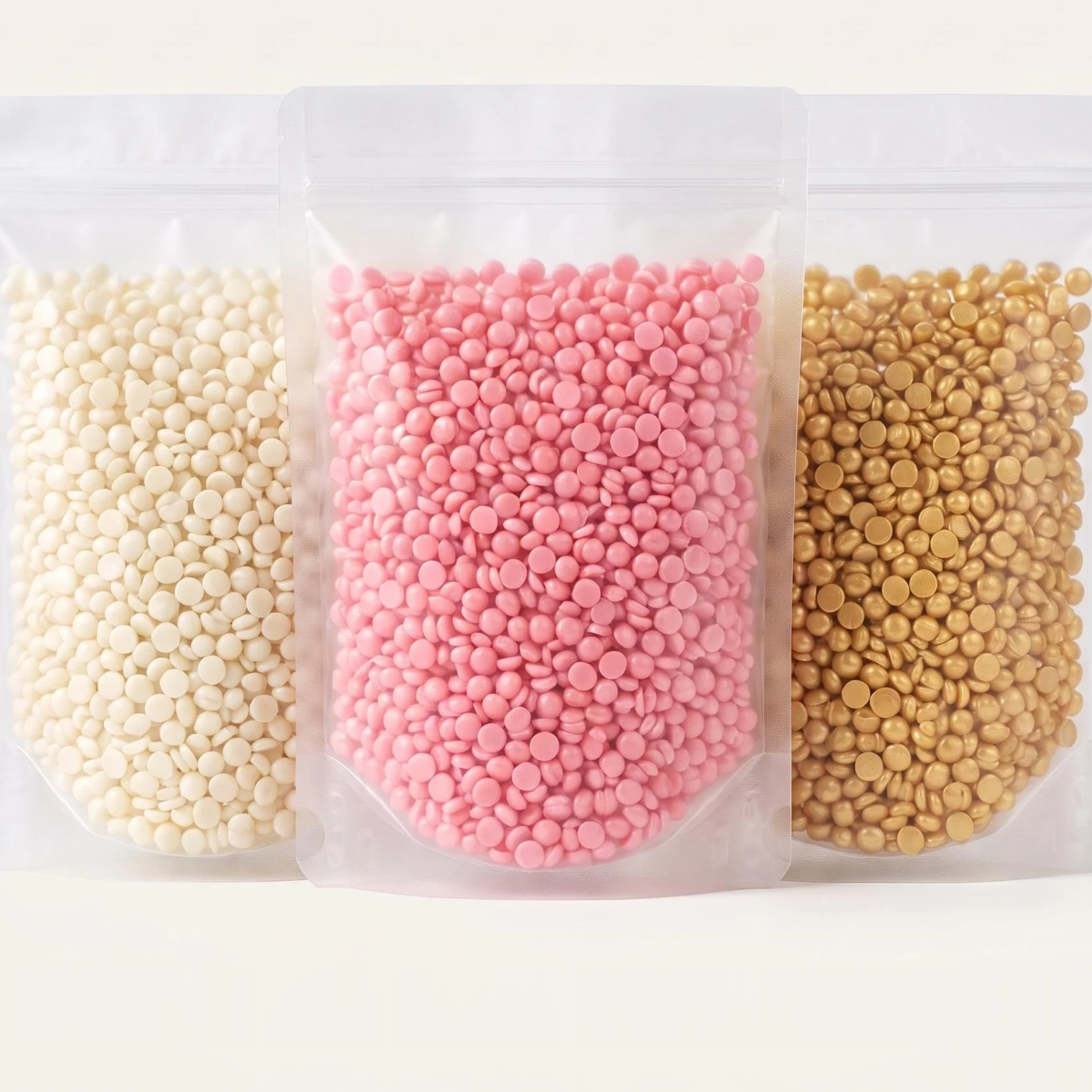 A1 rosin-free hard wax beads in white, pink and gold, packed in resealable pouches