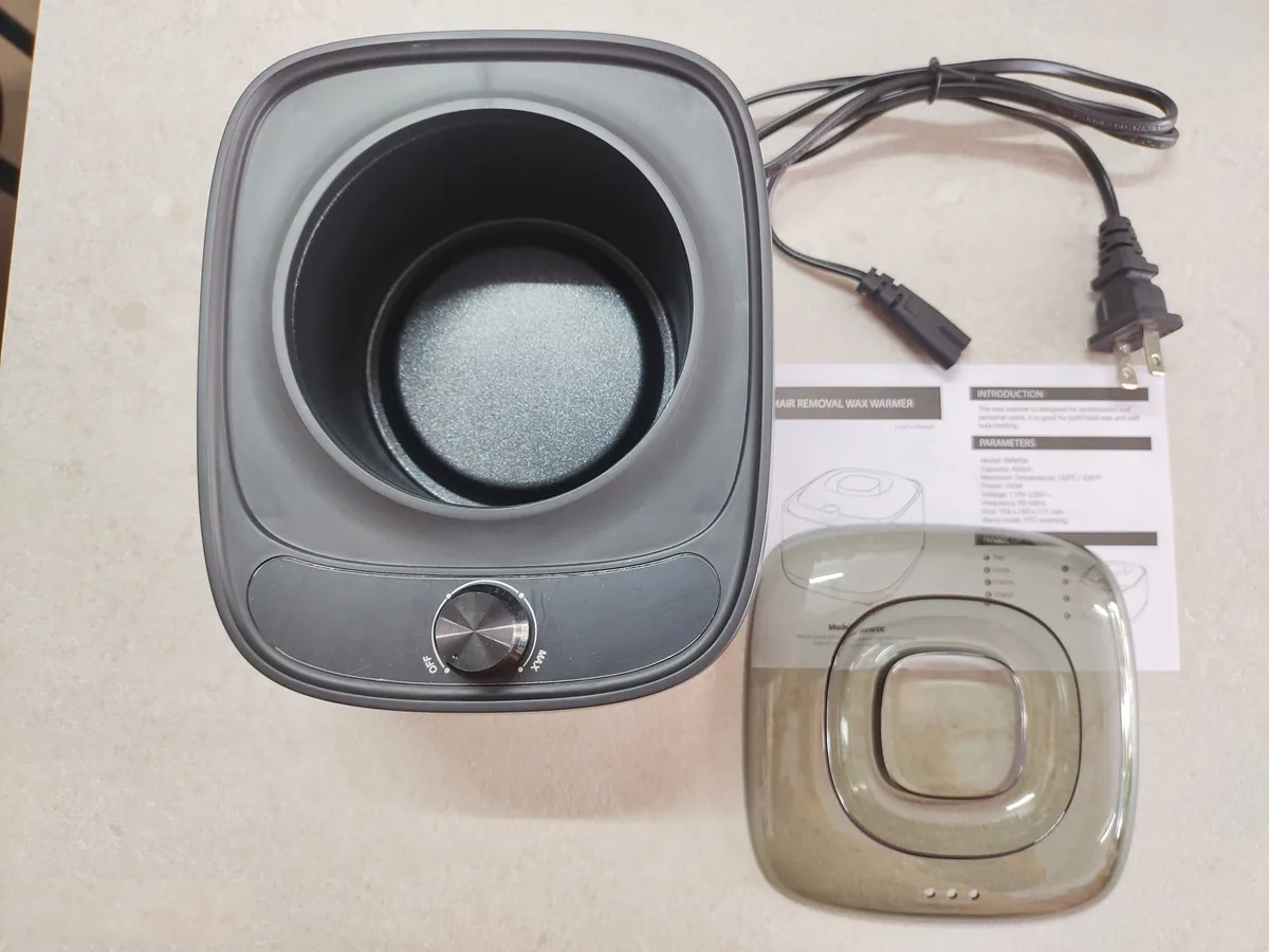 BeauTome BWW5K wax heater unboxing — production units and packaging photographed in the factory