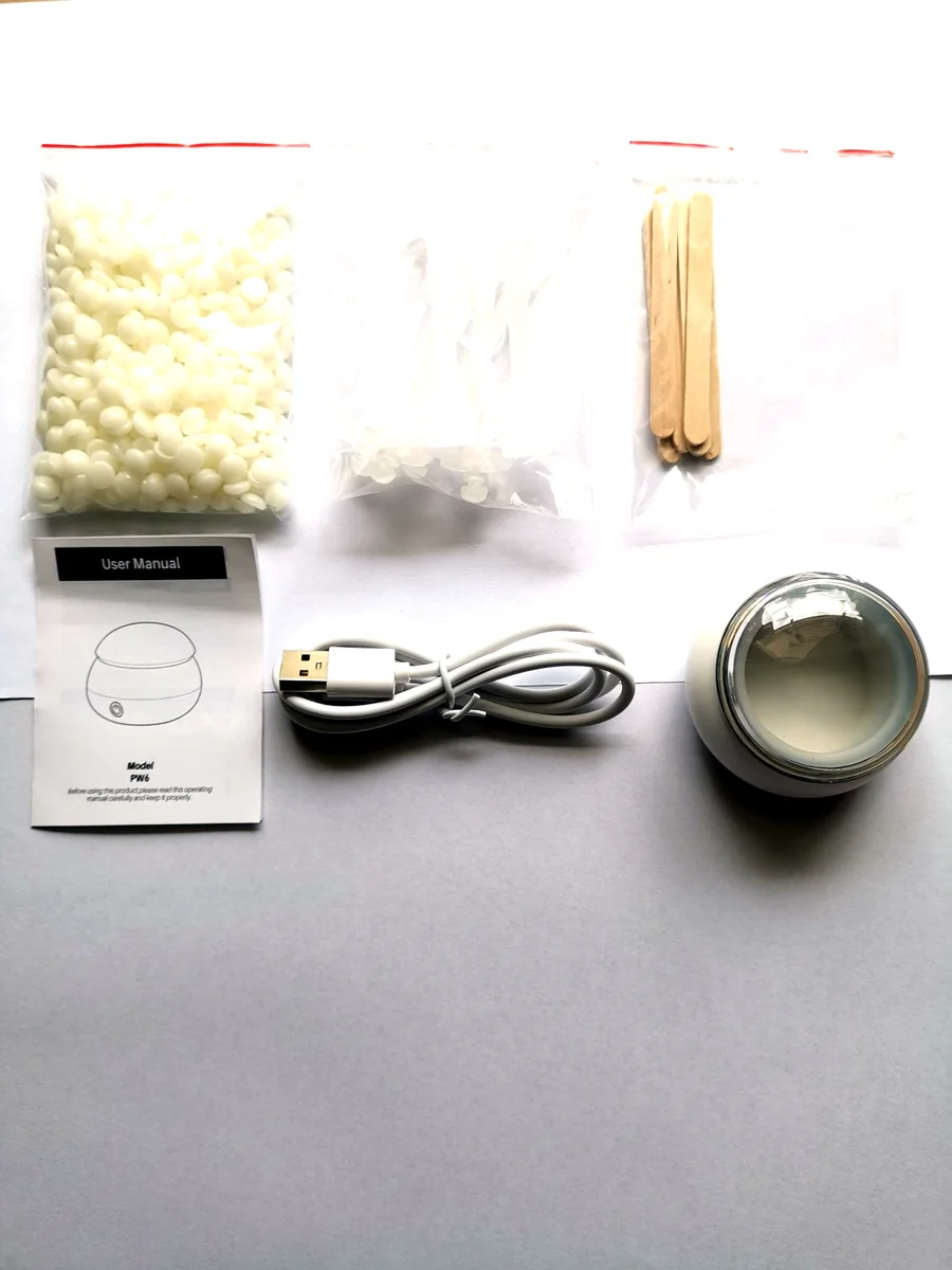 PW6 nose wax kit contents: hard wax beads, silicone pots, wooden applicator sticks, user manual, USB Type-C cable and the PW6 heater