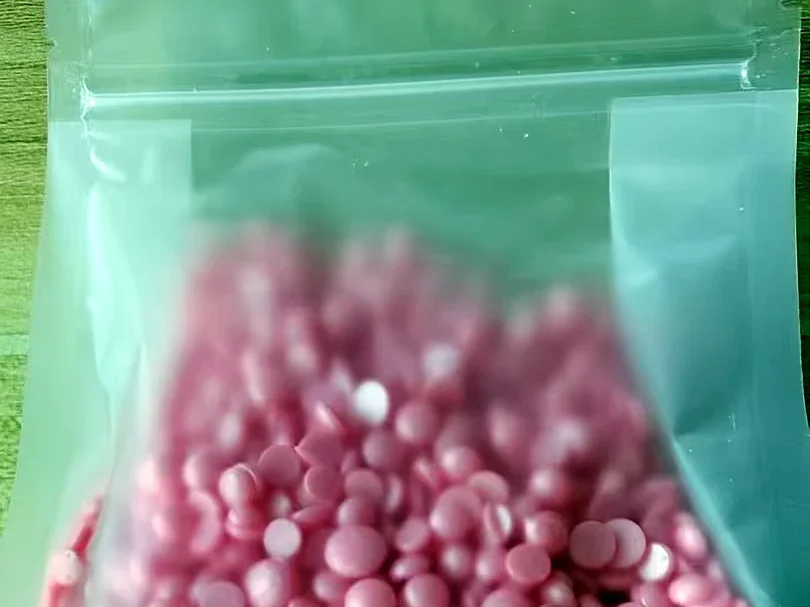 BeauTome A1 rosin-free hard wax pink beads in unlabeled transparent bag — real photo